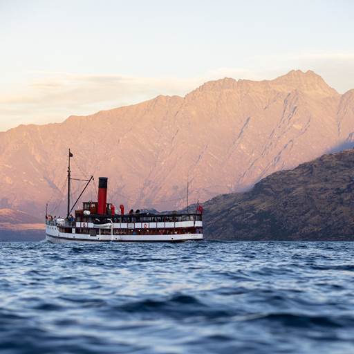 The TSS Earnslaw sailing in front of the Remarkables