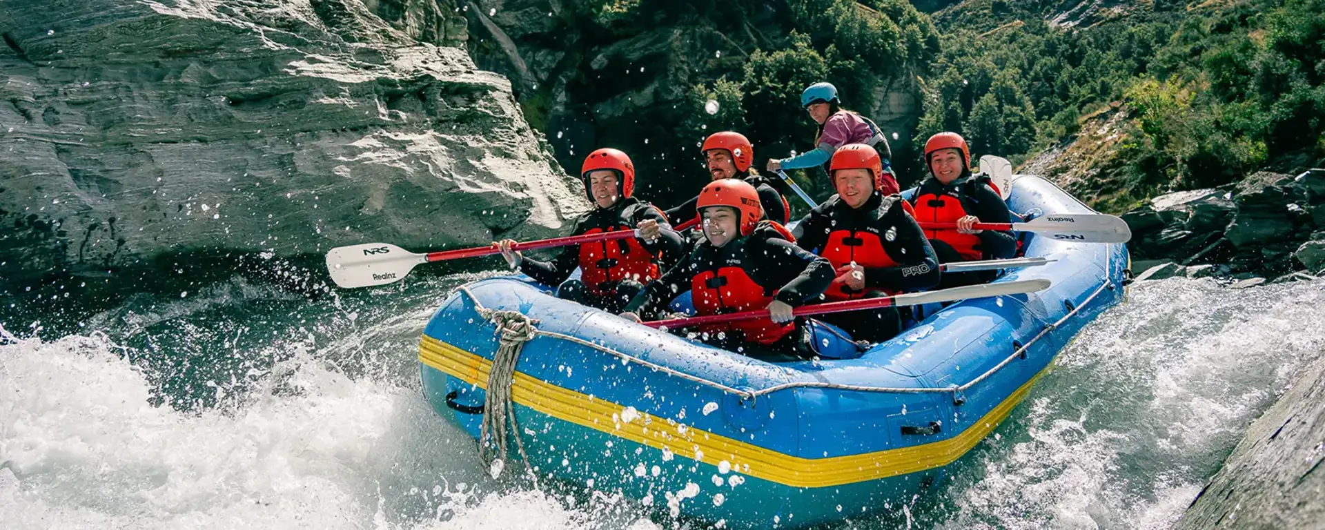 A group pf five rafter, plus a guide, tackle a grade 5 rapid.