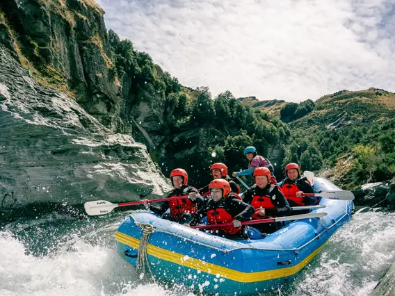 A group pf five rafter, plus a guide, tackle a grade 5 rapid.
