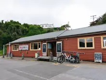 The Red Shed e-bike rental building on Stewart Island.