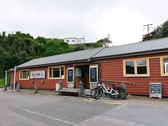 The Red Shed e-bike rental building on Stewart Island.