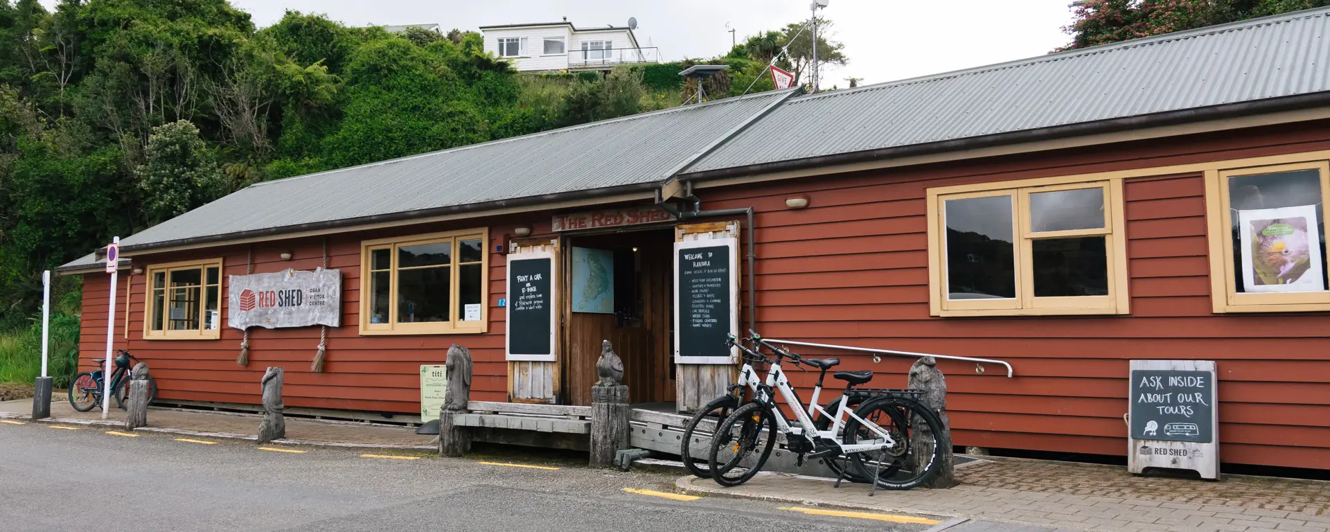 The Red Shed e-bike rental building on Stewart Island.