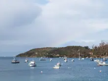 Boats anchored in a sheltered bay near Stewart Island.