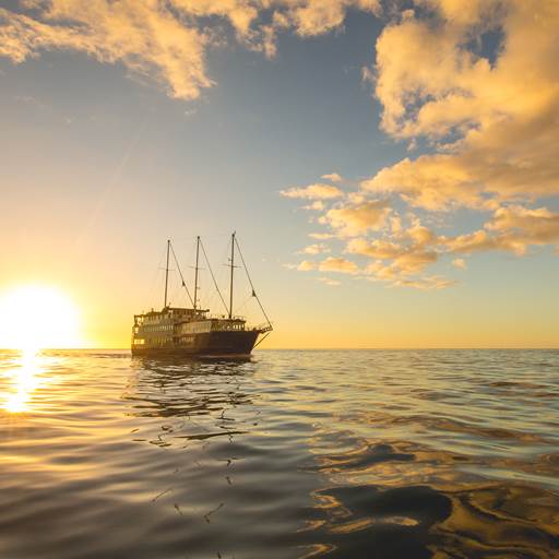 Boat sailing at sunset