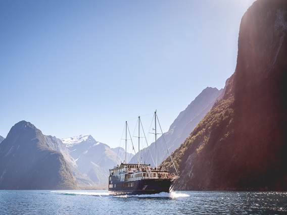 Boat cruising on Milford Sound