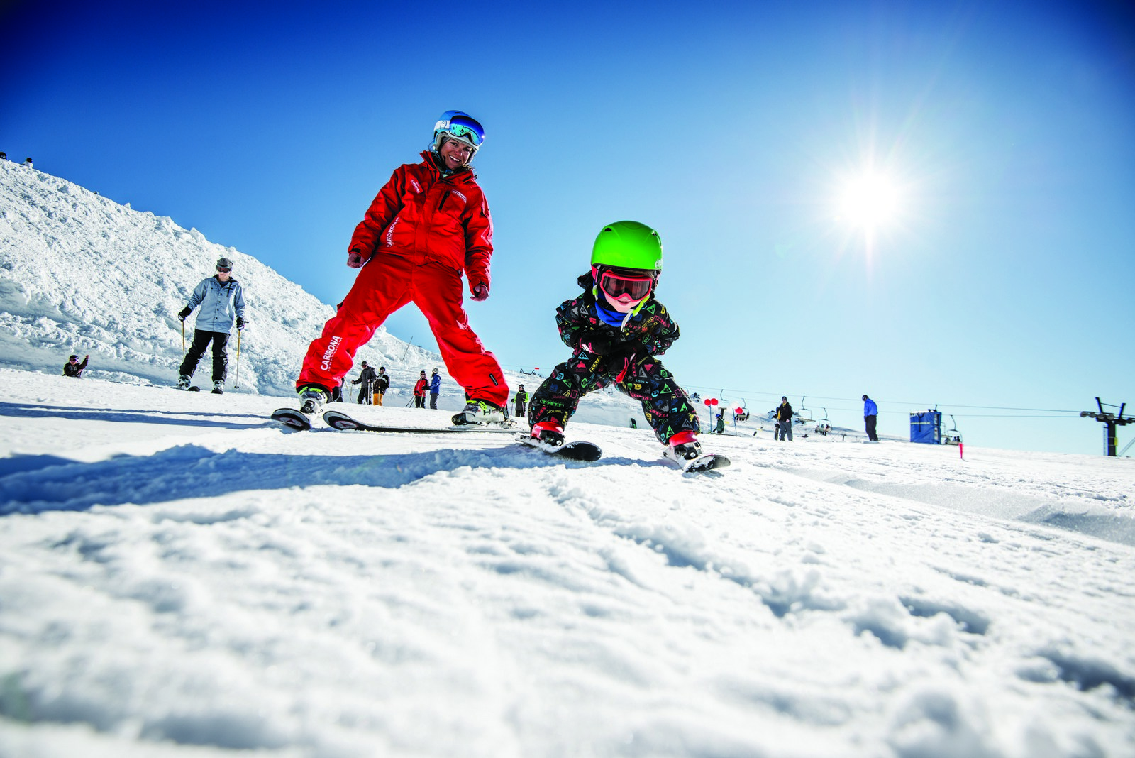 Child learners to ski with instructor at Cardrona Alpine Resort