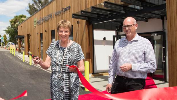 Robynne Peacock cutting the ribbon at visitor centre