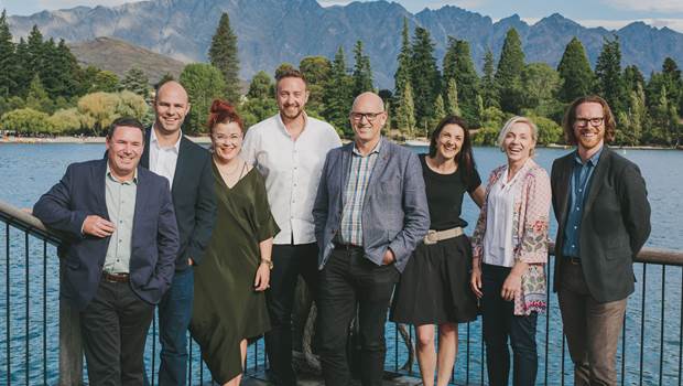 Senior Leadership team in front of the remarkables