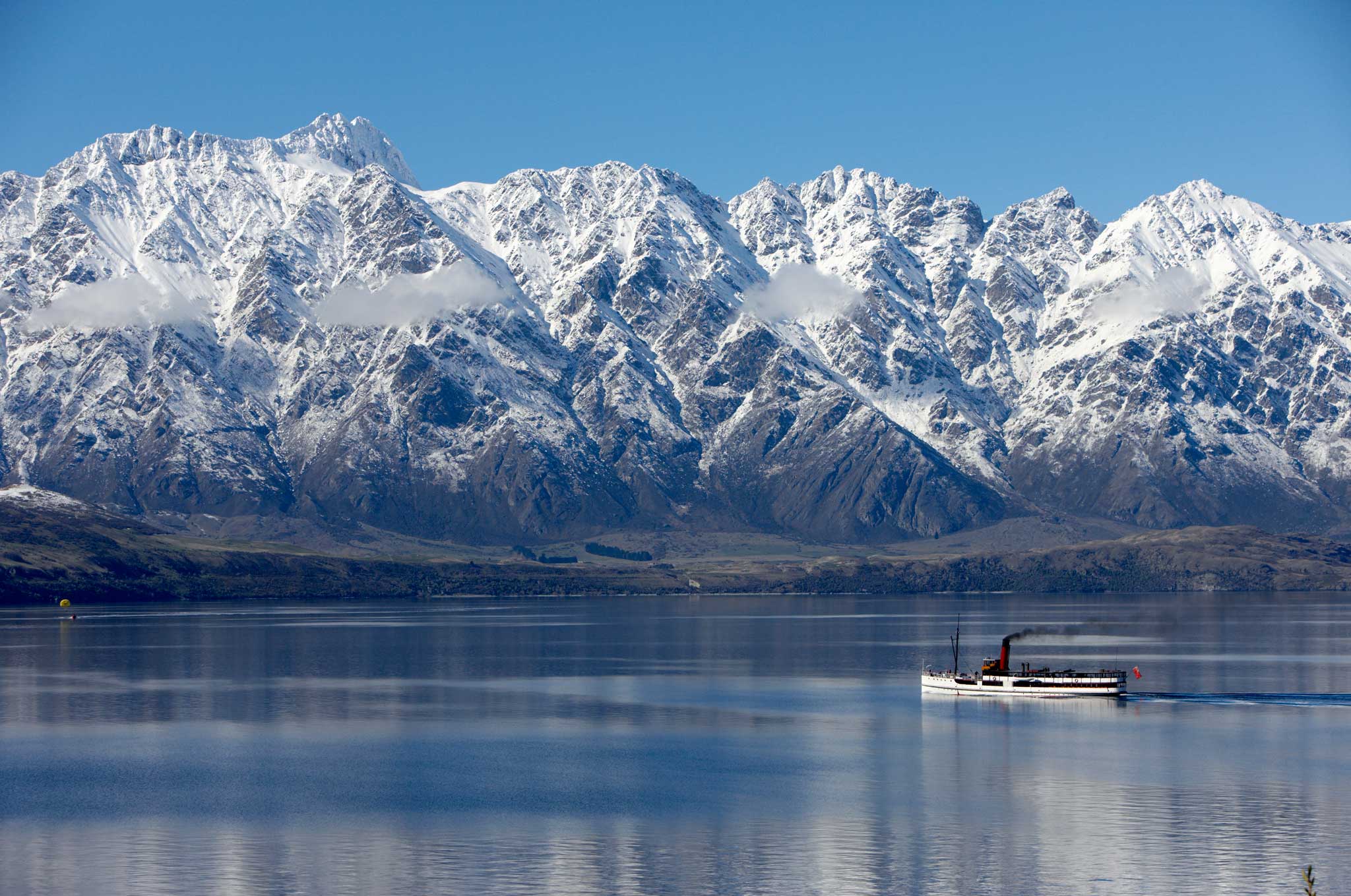 TSS Earnslaw with snowy remarkables