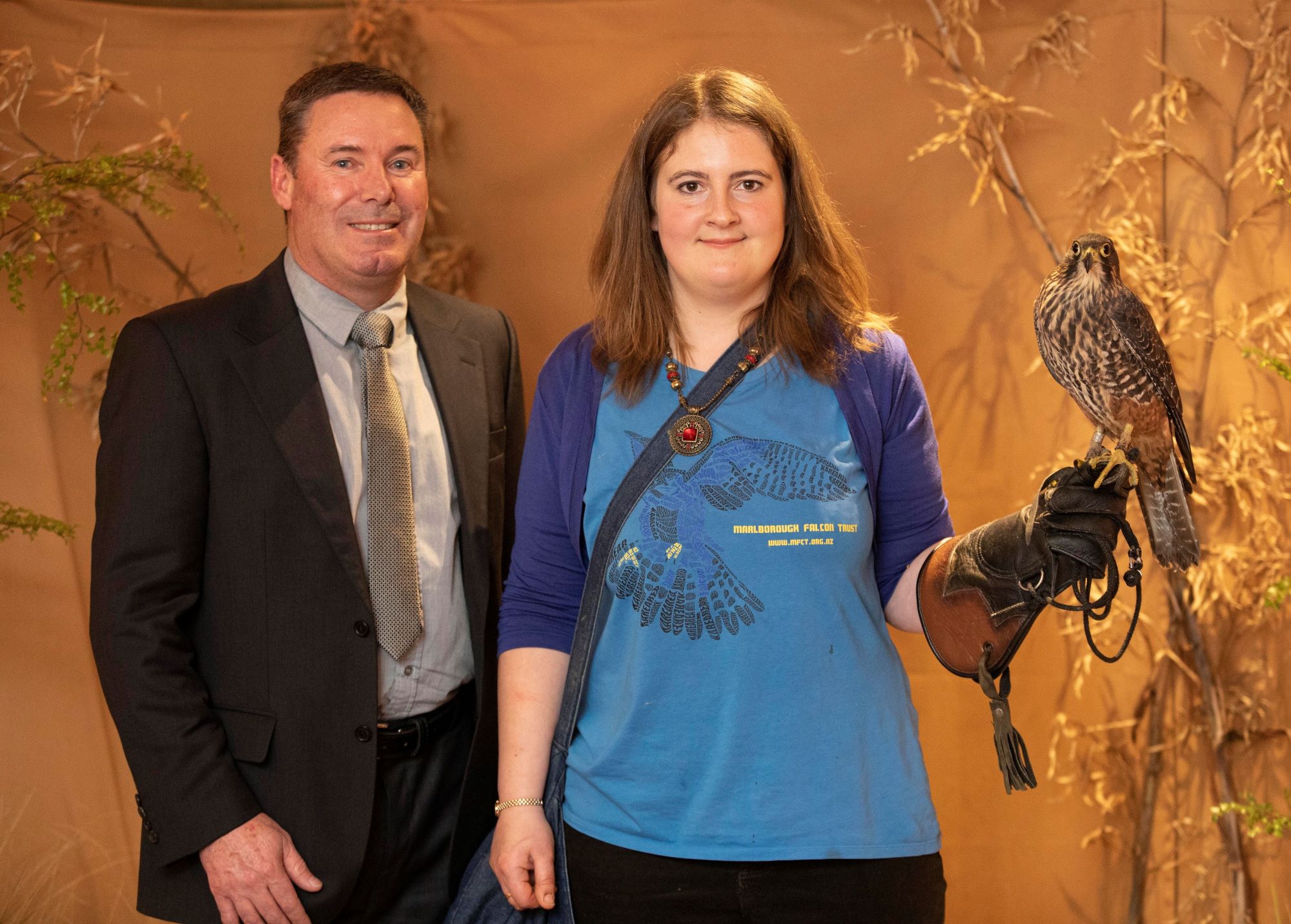 Paul Norris & Dr Victoria Smith posing with Kārearea Falcon