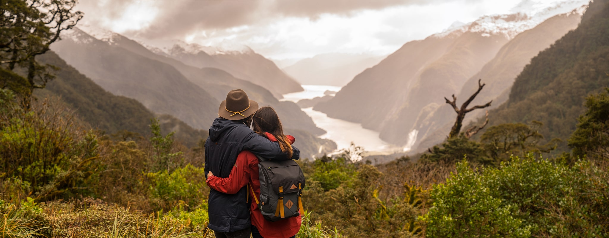 Couple at the Wilmot pass overlooking Doubtful Sound