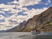Vintage Steamship, TSS Earnslaw, on Lake Wakatipu surrounded by Queenstown Mountains