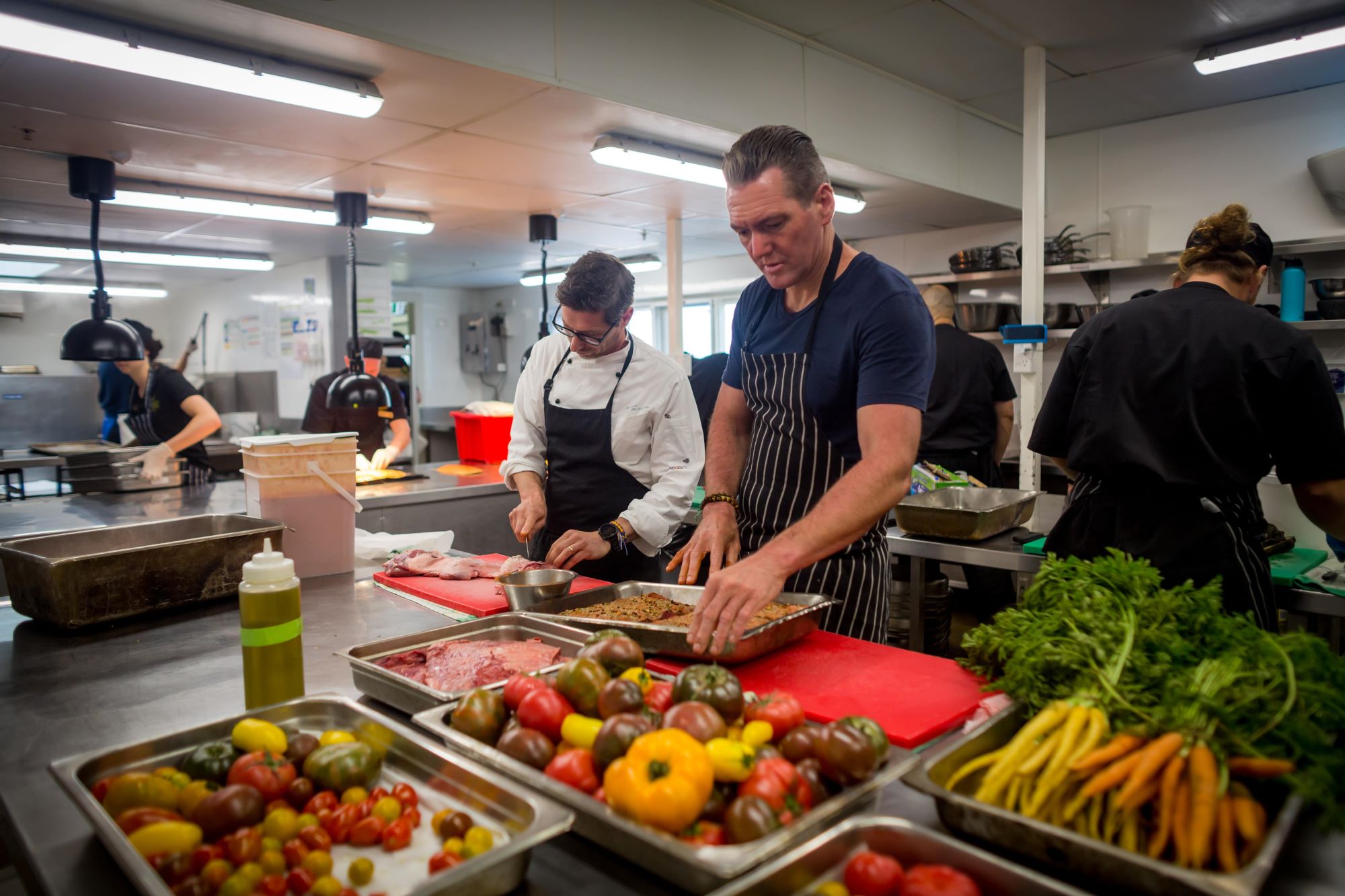 Mauro Battaglia and Justin North hard at work in the kitchen at Walter Peak High Country Farm