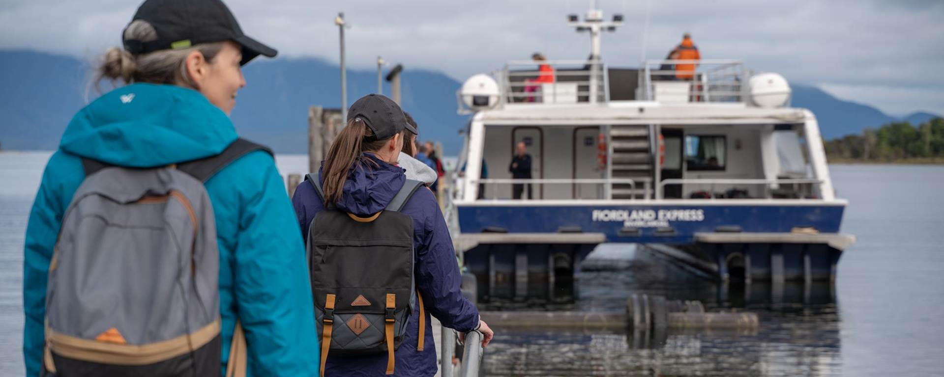 Walkers boarding the Milford Track Ferry at Te Anau Downs