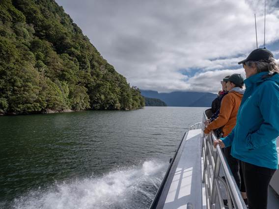 Walkers onboard the ferry, on the way to start the Milford Track Great Walk