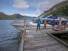 Walkers disembarking boat at Glade Wharf to start the Milford Track