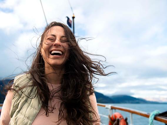 Woman laughing on the TSS Earnslaw