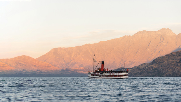 The Tss Earnslaw sails in front of the Remarkables