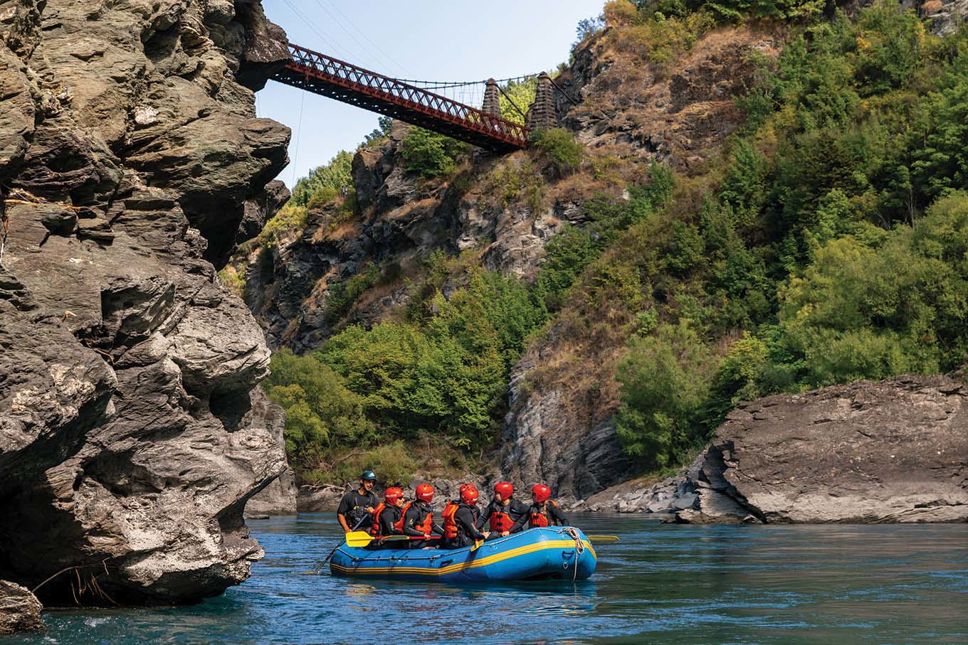 A raft sailing under the Kawarau bridge