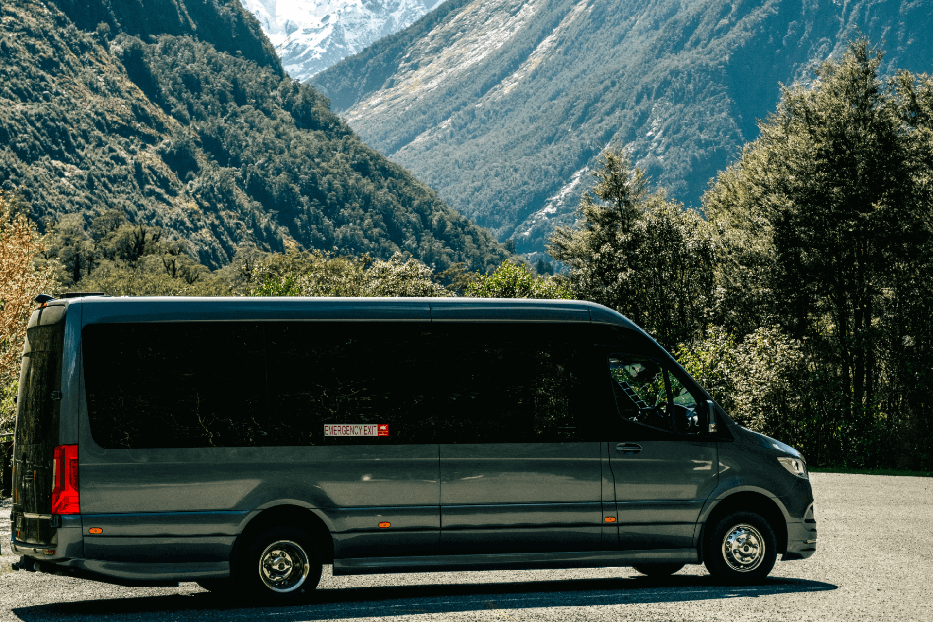 Altitude Mercedes sprinter parked at the side of the Milford Road on a sunny day.