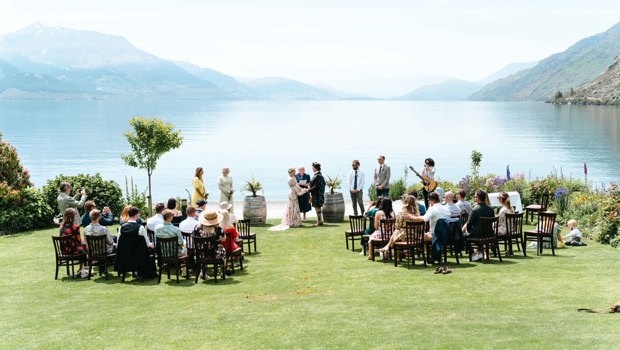 Wedding ceremony by the lake at Walter Peak High Country Farm.