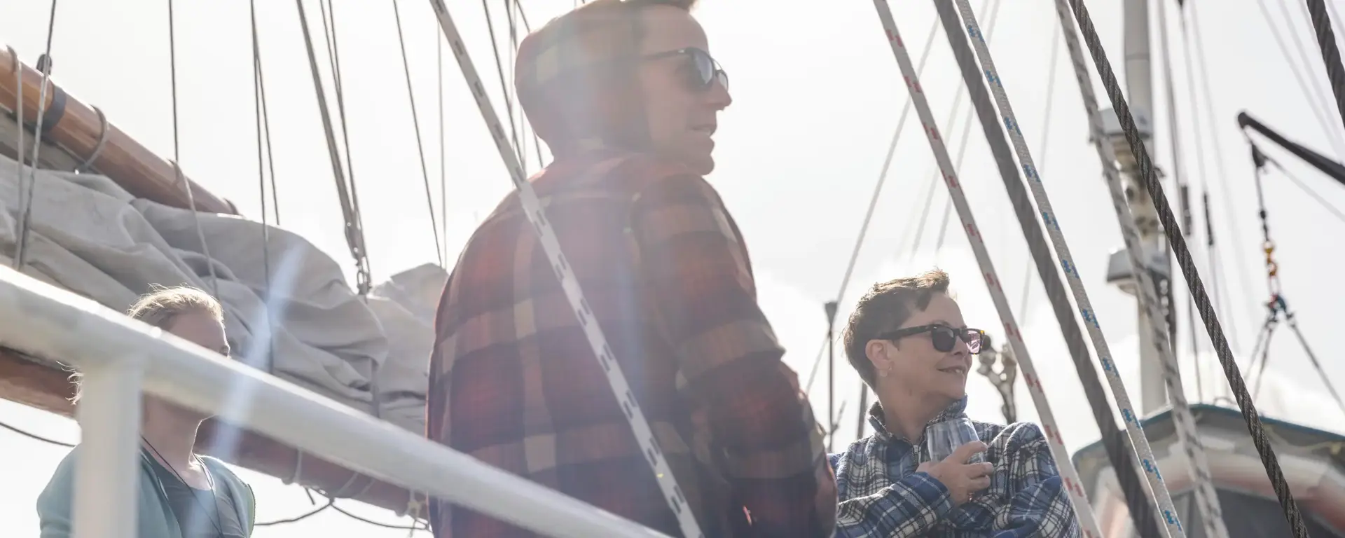 Guests enjoying the view from the deck of an expedition vessel.
