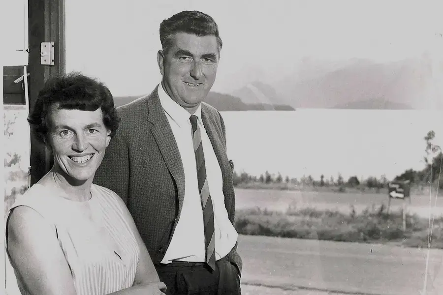 Black-and-white photo of Les and Olive Hutchins standing together.